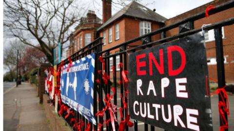 A placard saying 'End Rape Culture' attached to the fence outside James Allen's Girls' School (JAGS) on March 28, 2021 in London,