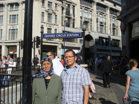 Aziz and his mother Helizkhan stood in front of Oxford Circus Station