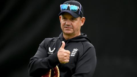 Matthew Mott gives a thumbs-up during England cricket practice