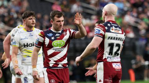 Harry Smith and Liam Farrell celebrate a Wigan try