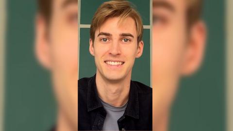 Gaming expert Nick Ballou smiling against a green background