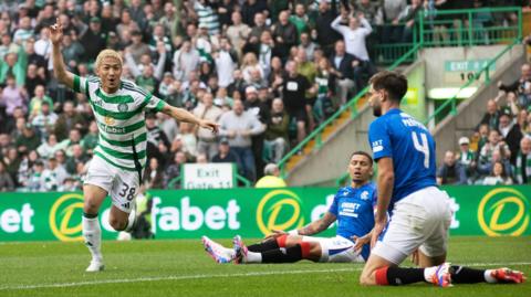 Daizen Maeda celebrates, while James Tavernier and Robin Propper watch on 