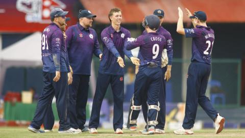Scotland players celebrate a wicket against USA