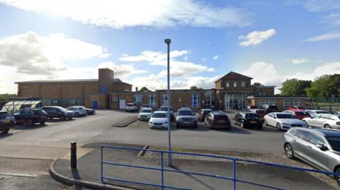 Exterior and car park of Holy Family Catholic High School in Carlton