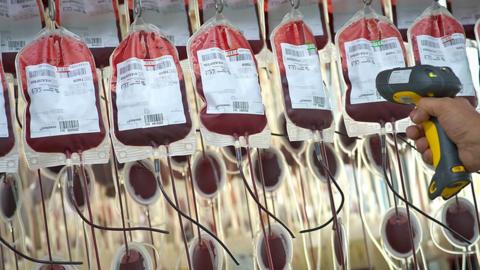 Bags of human blood being filtered and scanned