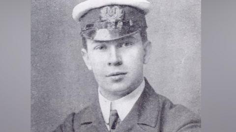 Jack Phillips, a telegraphist on board the Titanic. Jack is wearing a suit, tie and sailors hat in this black and white image.