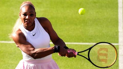 Serena Williams plays a backhand shot