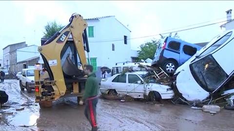 Cars piled up on a muddy road