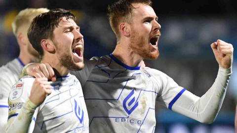 Wigan celebrate victory at Wycombe