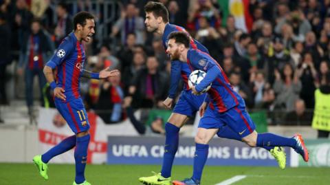 Barcelona forward Neymar celebrates along with Gerard Pique after Lionel Messi scores a penalty against Paris St-Germain in the Champions League