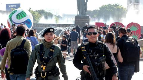 Two police officers guard the area after in front of a giant football installed as part of the 100 days leading up to the 2026 Fifa World Cup, in Guadalajara