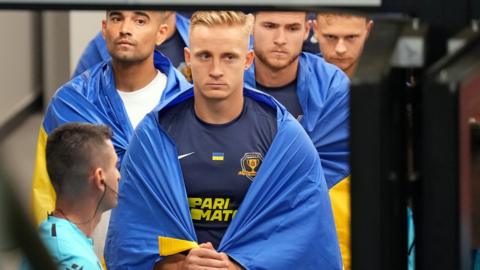 Dnipro captain Oleksandr Svatok waits in a tunnel before match