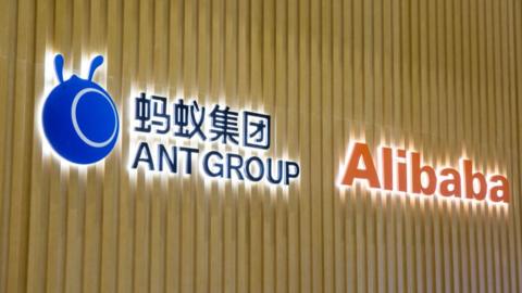 Alibaba and Ant Group logos on a wall