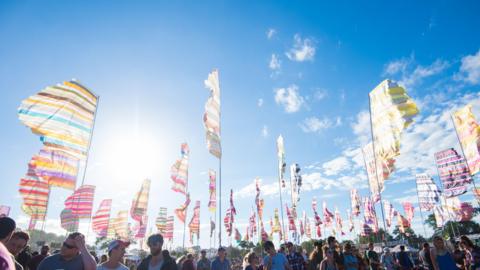 A bright blue sky with some patches of cloud at Glastonbury Festival.