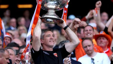 Kieran McGeeney lifts the Sam Maguire trophy