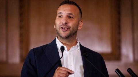 Leader of the Green Party of England and Wales, Zack Polanski, delivers a speech