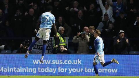 Patrick Agyemang jumps high to celebrate Derby's winner at Deepdale