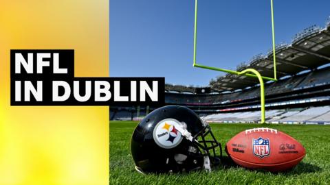 A Pittsburgh Steelers helmet and an American football on the side of a pitch
