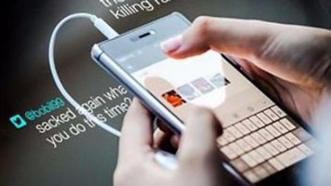 Photo of a person using a smartphone. 