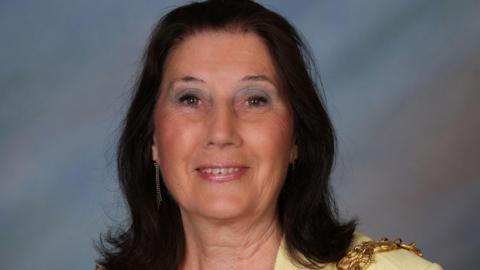 Jenny Barron in a professional photograph. She is made up and has the mayoral chains on. She is wearing fancy earrings. 