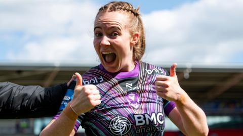 Dani McGifford after St Helens' win over Leeds Rhinos in the Challenge Cup smiling at the camera with her thumbs up.