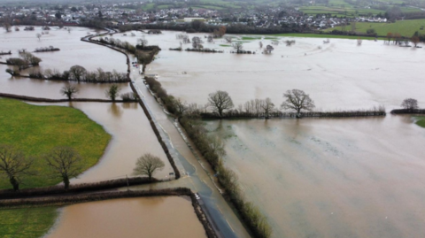Drone still of flooded fields in Axminster, Devon, caused by Storm Chandra.