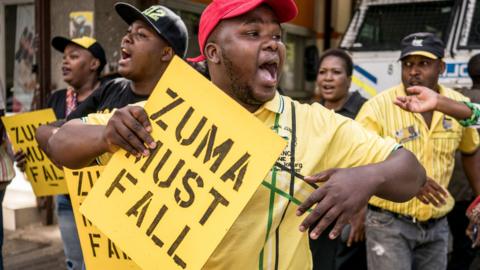 Supporters of ANC president Cyril Ramaphosa chant slogans outside party headquarter in Johannesburg, on February 5, 2018