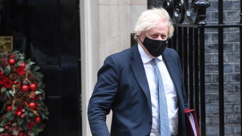 Boris Johnson wears a mask at Downing Street this week