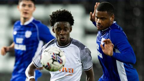 Maliq Cadogan of Swansea City in action against Vontae Daley-Campbell of Cardiff City.