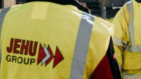 Three construction workers in Jehu high visibility jackets and hard hats