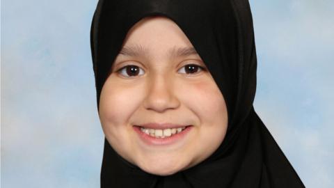 Sara Sharif wearing a hijab. She is smiling and looking directly at the camera. 