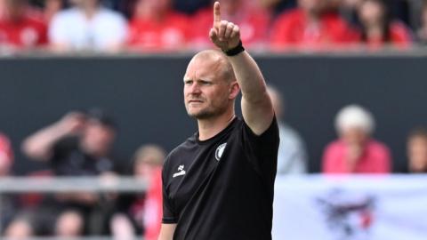Bristol City boss Liam Manning directs his players during the final game of the season against Preston