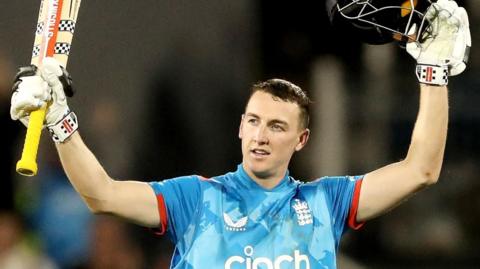 England captain Harry Brook celebrates hitting a century