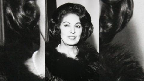 A black and white photo of Consuelo Velazquez in which she has dark curly hair.