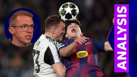 Dan Burn challenges a Barcelona player