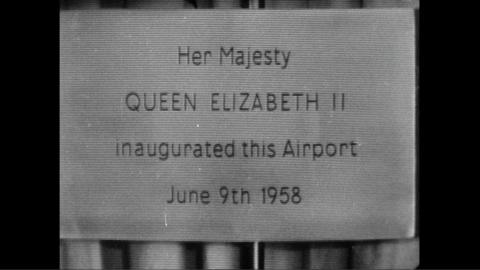 A plaque which reads 'Her Majesty QUEEN ELIZABETH II inaugurated this Airport June 9th 1958'.