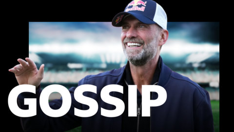 A graphic with the word "Gossip" imposed over a close-up of Jurgen Klopp. He is wearing a navy Red Bull cap and navy jacket.