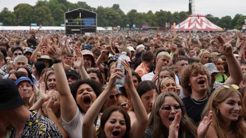 A crowd of people cheering