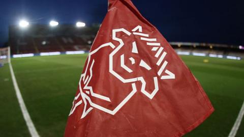 Lincoln City crest on a corner flag