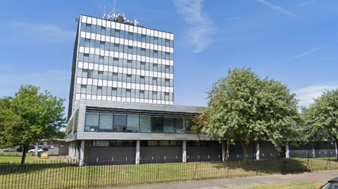 A photo of the Halton Borough Council building