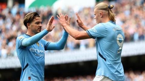 Jack Grealish and Erling Haaland