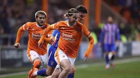 Josh Bowler sprints away from a Carlisle United opponent in the FA Cup tie between the sides in December