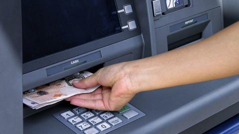 ATM dispensing cash
