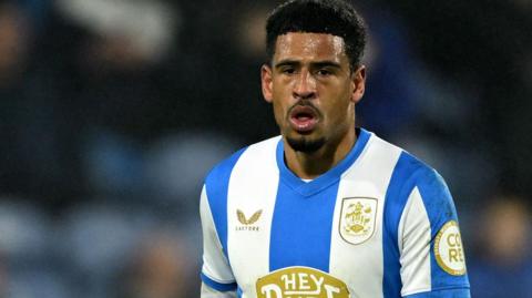 Marcus McGuane in action for Huddersfield Town