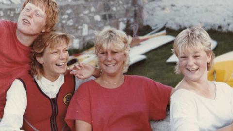 Suzy Lamplugh (second left) with her siblings, (left to right) Richard, Tamsin and Lizzie. All four have blonde hair, are smiling, and appear to be in their twenties.