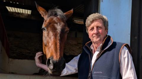 Trainer Jeremy Scott with defending Champion Hurdler Golden Ace