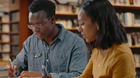 A pictures of students in a library - stock image