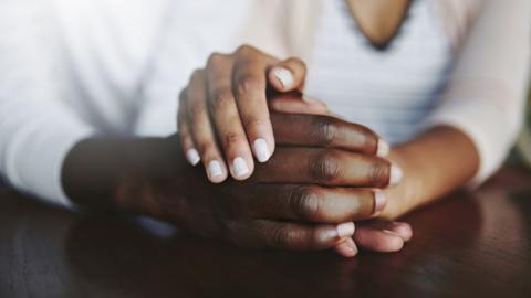 Couple hold hands