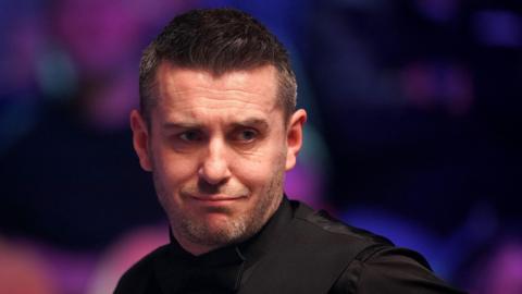 Mark Selby looks at the table