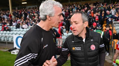 Jim McGuinness and Brian Dooher shake hands after the Ballybofey contest